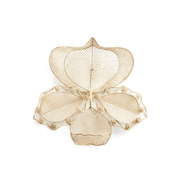 The Macranta Wall Decor by Ames is an intricate metal sculpture featuring stylized orchid or butterfly shapes, reminiscent of Coryanthes Macrantha, with delicate mesh and scroll patterns against a plain white background.
