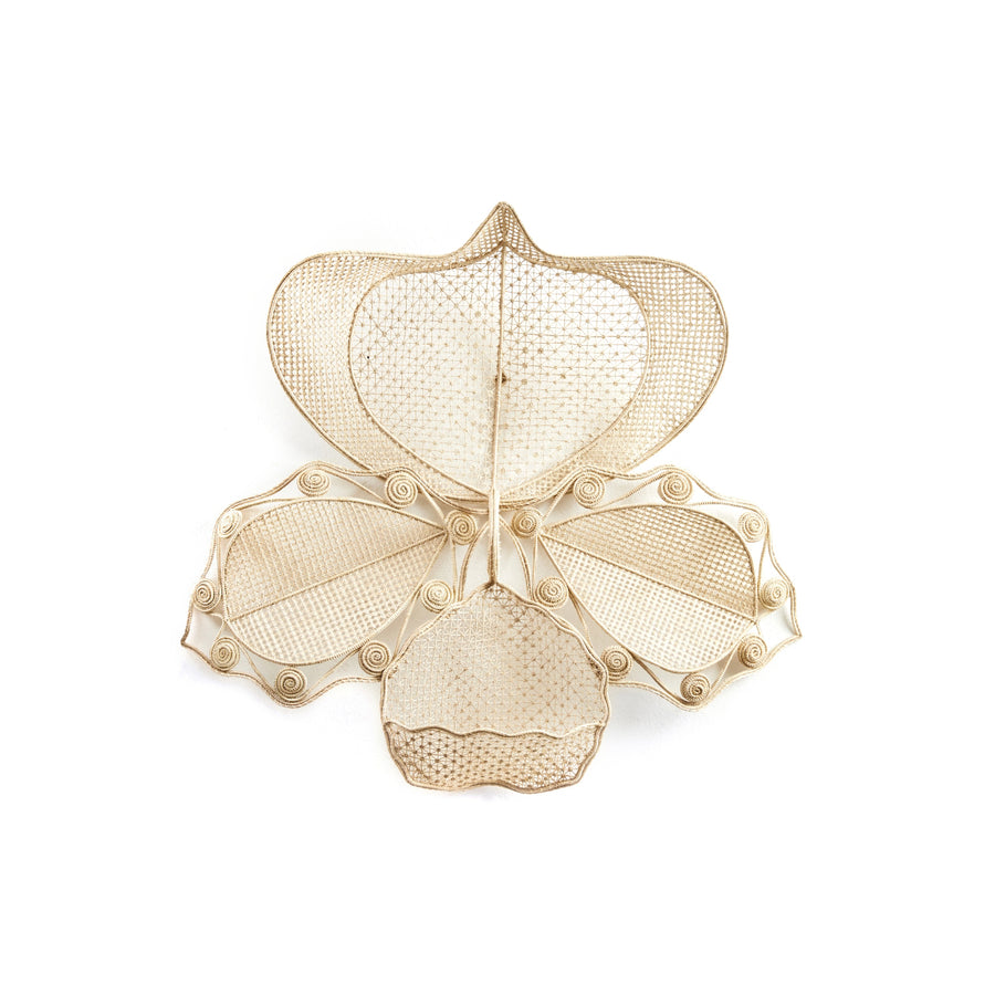 The Macranta Wall Decor by Ames is an intricate metal sculpture featuring stylized orchid or butterfly shapes, reminiscent of Coryanthes Macrantha, with delicate mesh and scroll patterns against a plain white background.
