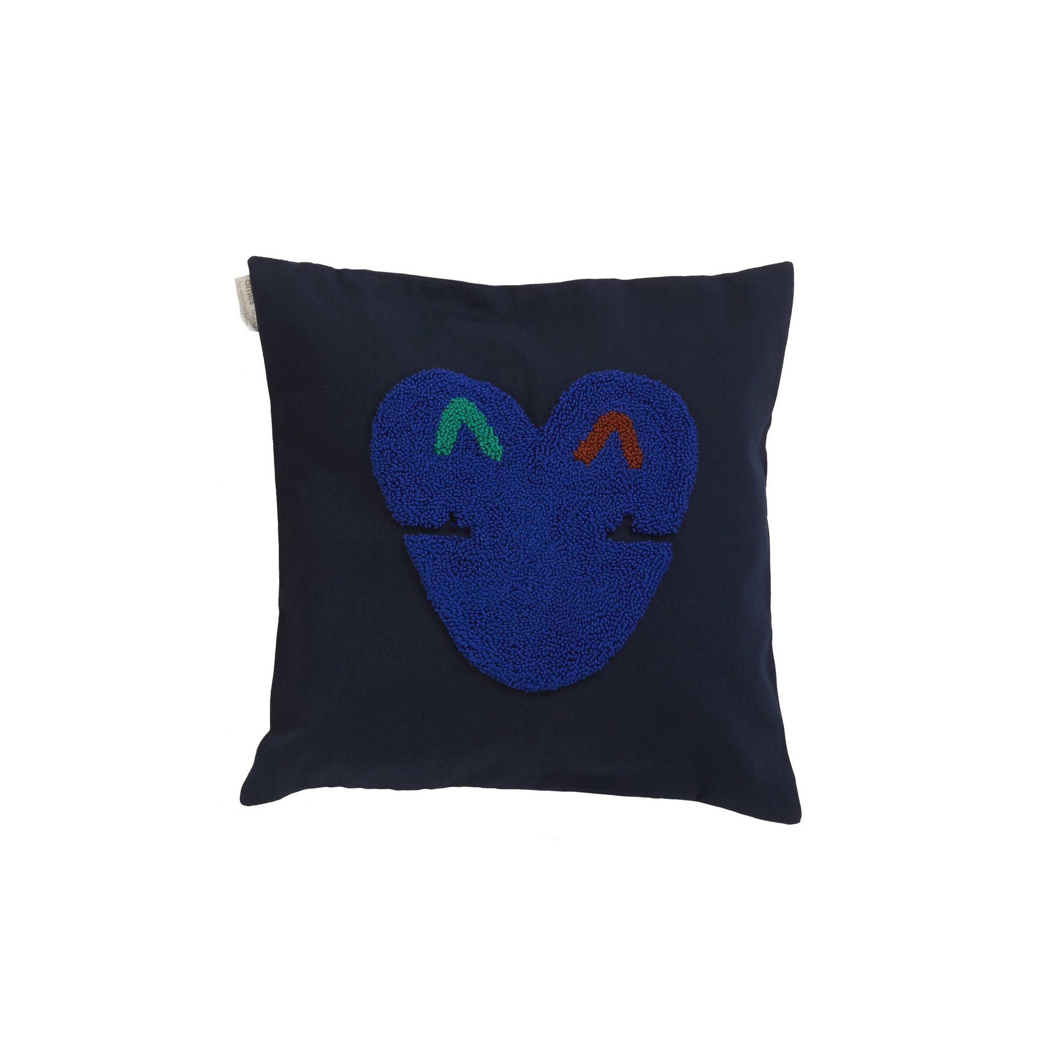 Introducing the Nido Kukuy by Ames: a dark blue throw pillow featuring an abstract design at its center. Crafted from 100% cotton, it showcases a stylized face in vibrant blue, green, and red—a perfect touch of artistic flair for your space while maintaining comfort with its plain background.