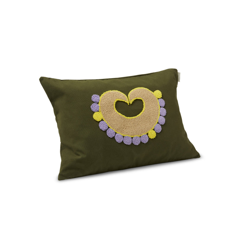The Ames Nido Piqui rectangular pillow features a green cover with an embroidered heart in yellow and beige, accented by small purple and yellow circles, exemplifying Sebastian Herkners exquisite handmade design.