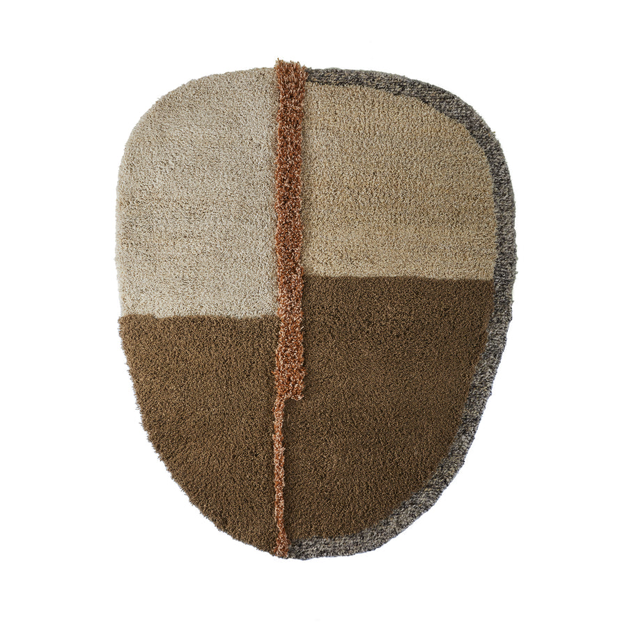 Explore the Ames Nudo Rug, an abstract piece with an irregular shape and four textured sections in beige, brown, and gray. A vertical brown strip divides the design, reflecting Colombian arts and crafts essence.