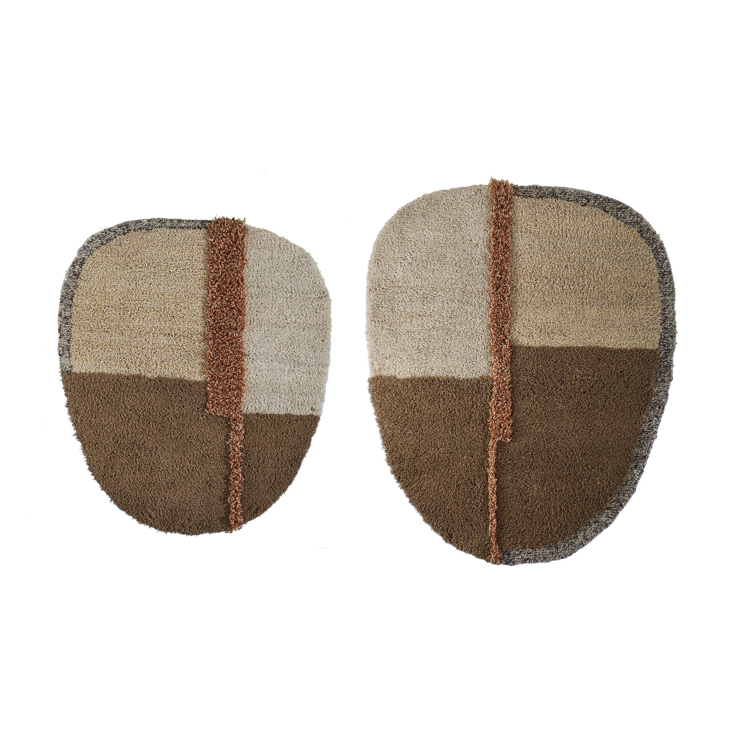 The Nudo Rug by Ames features two abstract, irregularly shaped deep-pile rugs in earthy tones. Each rug has four segments: beige (top left), light brown (top right), dark brown (bottom left), and dark beige (bottom right), divided by a textured brown strip, reflecting Colombian arts and crafts.