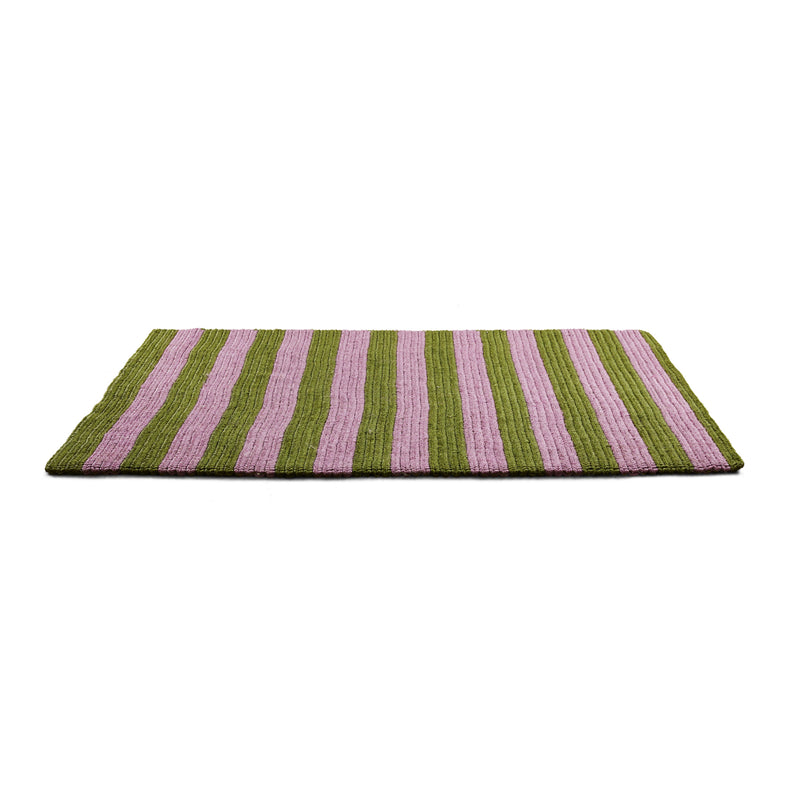 The Par Raya Rug by Ames elegantly features green and purple vertical stripes on a white background. Crafted from natural fibers, it seamlessly combines traditional handmade techniques with modern aesthetics.