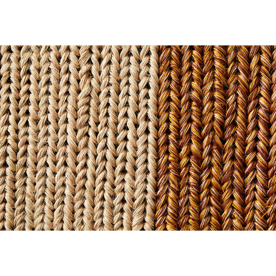 Close-up of two woven patterns on the Ames Par Rug by Ames: one side with light beige threads, the other with brown, orange, and yellow—showcasing the unique handmade textures of this distinct rug.