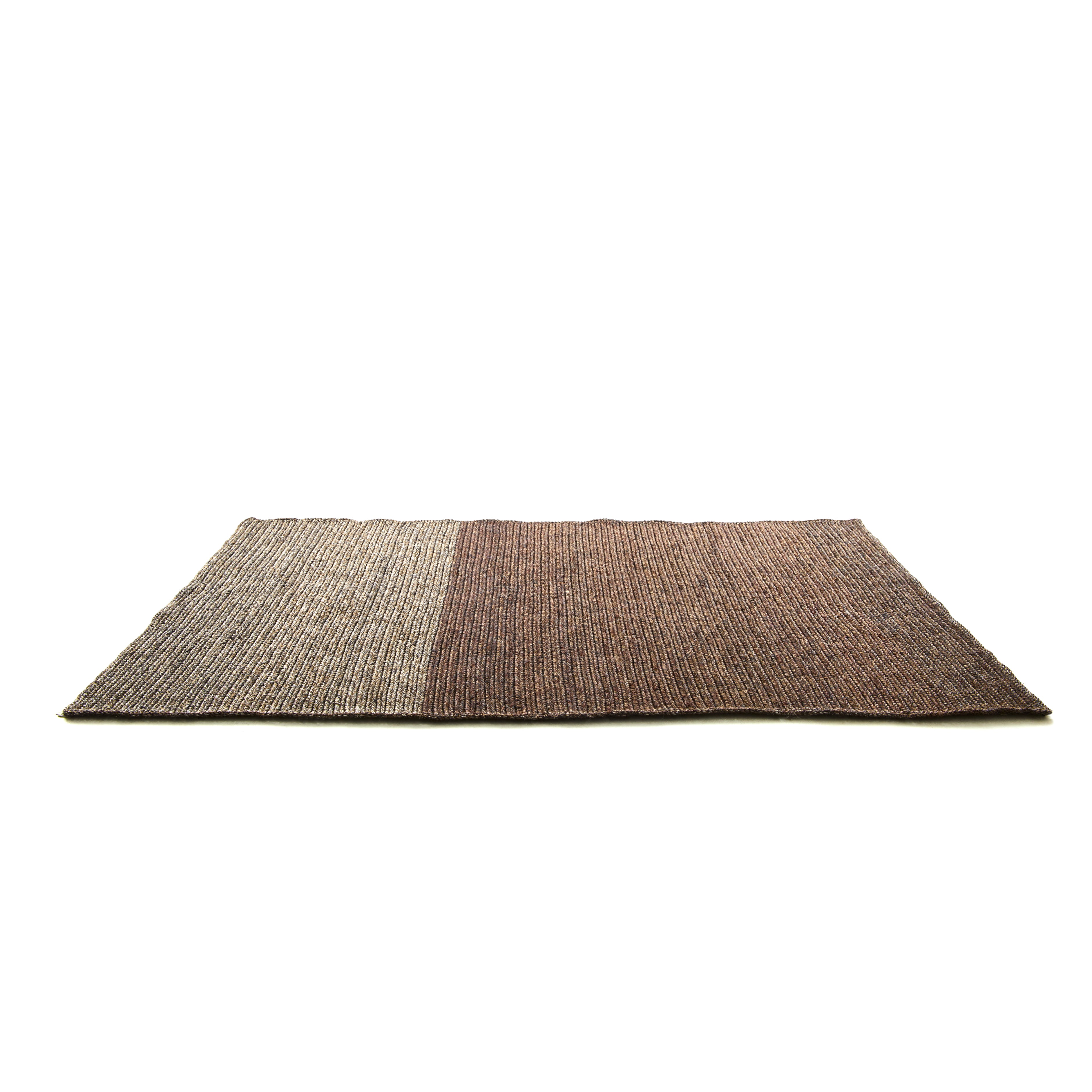 The Ames Par Rug by Ames is a rectangular handmade rug with two color blocks—light beige on the left and dark brown on the right—expertly crafted and displayed against a white background.