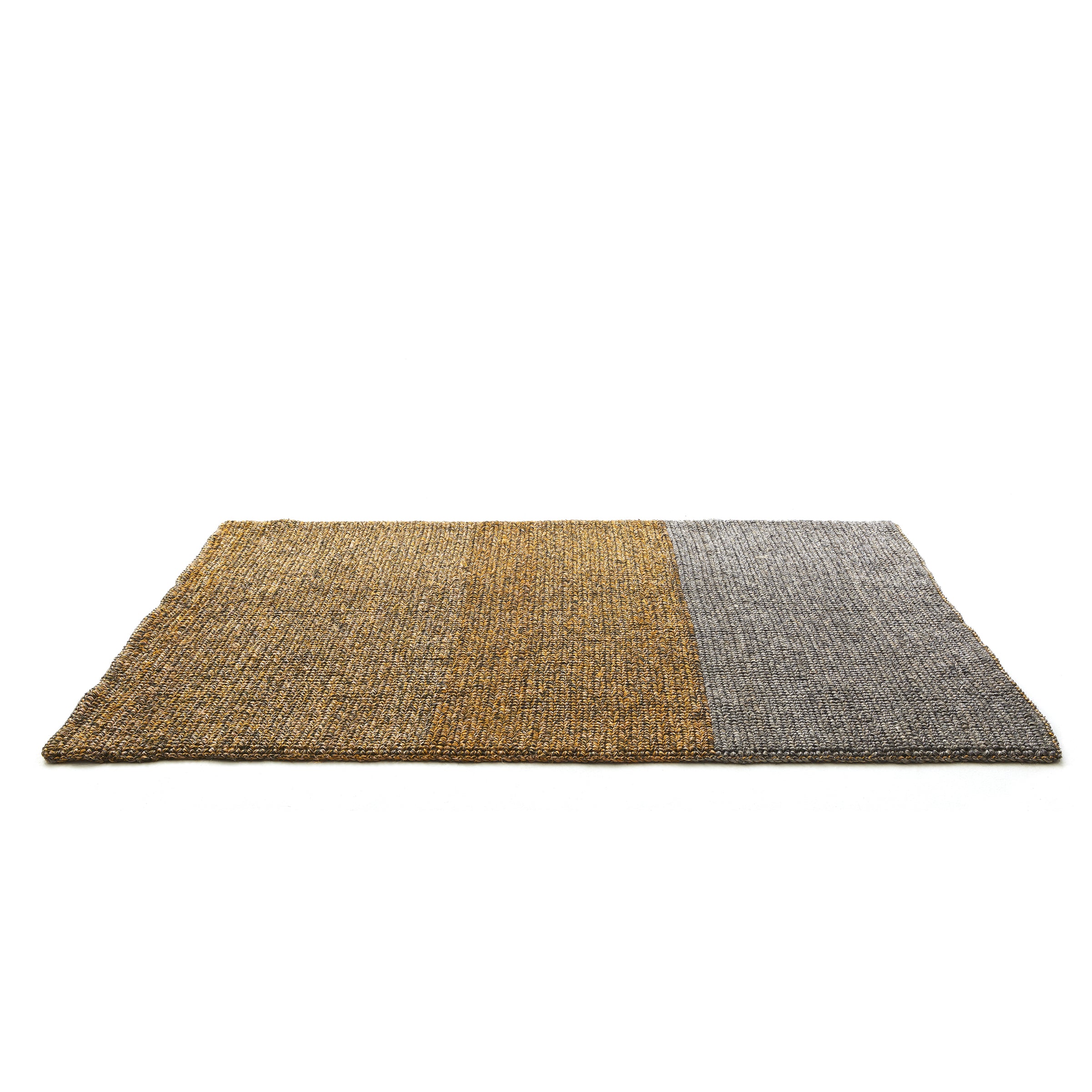 The Ames Par Rug by Ames is a rectangular handmade rug with mustard yellow and gray color blocks, shown on a white background. Its design highlights the unique texture characteristic of artisanal craftsmanship.