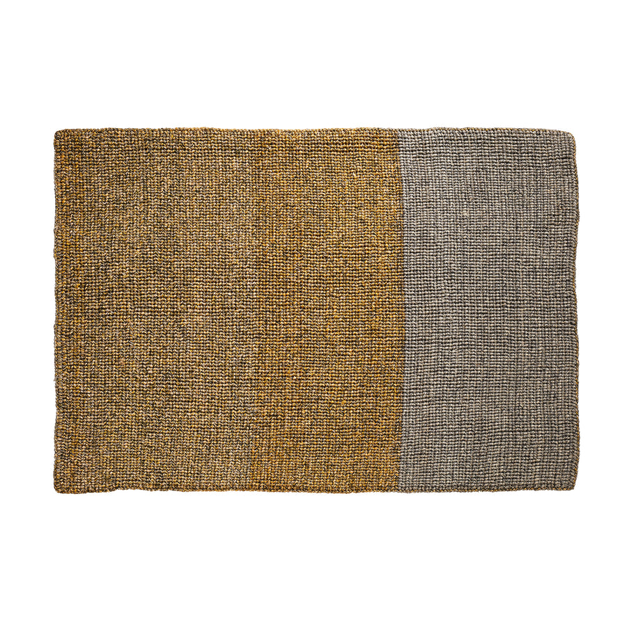 The Ames Par Rug by Ames is a rectangular handmade rug featuring a two-tone design: mustard yellow on the left and gray on the right, both with textured, speckled details that give this unique piece its traditional-inspired charm.