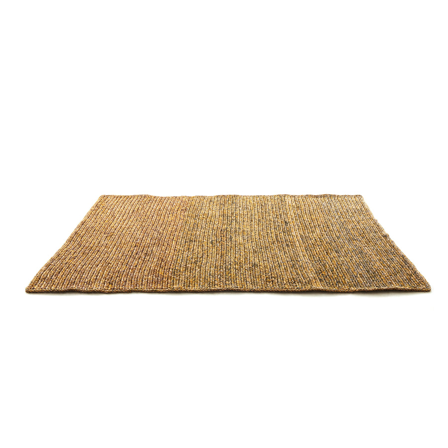The Ames Par Rug by Ames is a handmade rectangular rug crafted from natural fibers, featuring a textured woven pattern in brown and tan shades, shown on a white background.