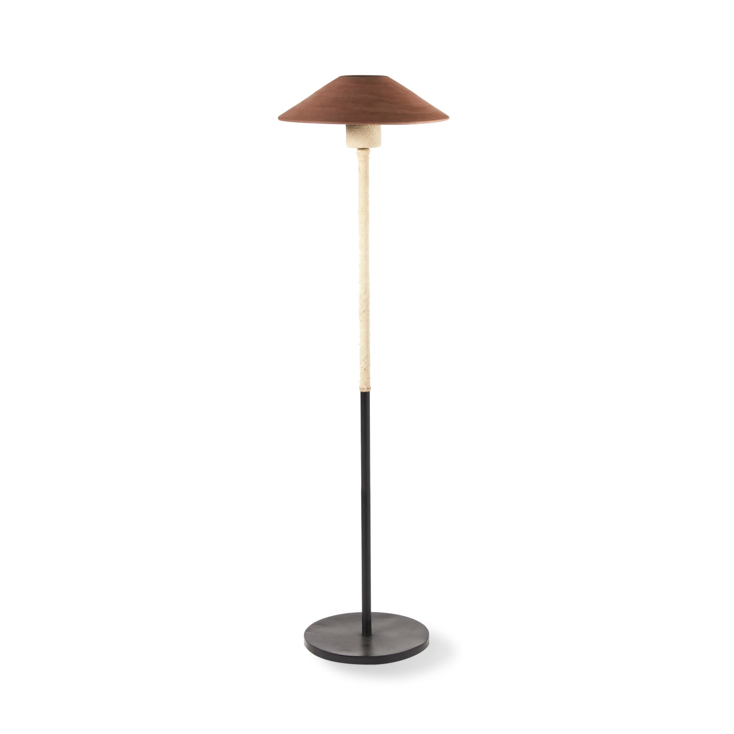The Ames Raiz Floor Lamp by Ames features a round black base, a slim black and beige stand, and a wide dark brown conical shade inspired by Colombian craftsmanship.
