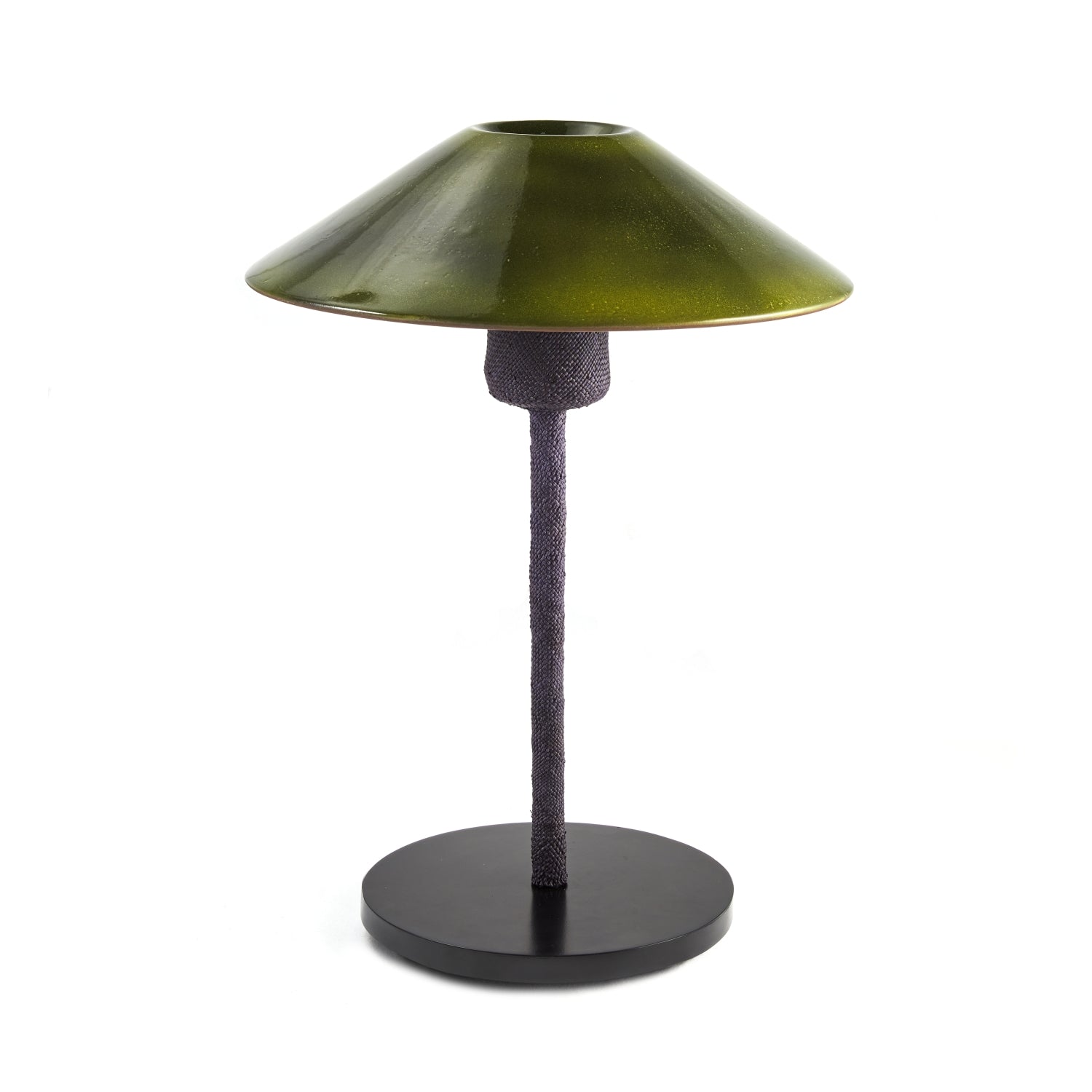 The Raiz Table Lamp by Ames combines Colombian craftsmanship in a modern, minimalist design featuring a dark green conical ceramic shade and a textured black stand on a round black base.