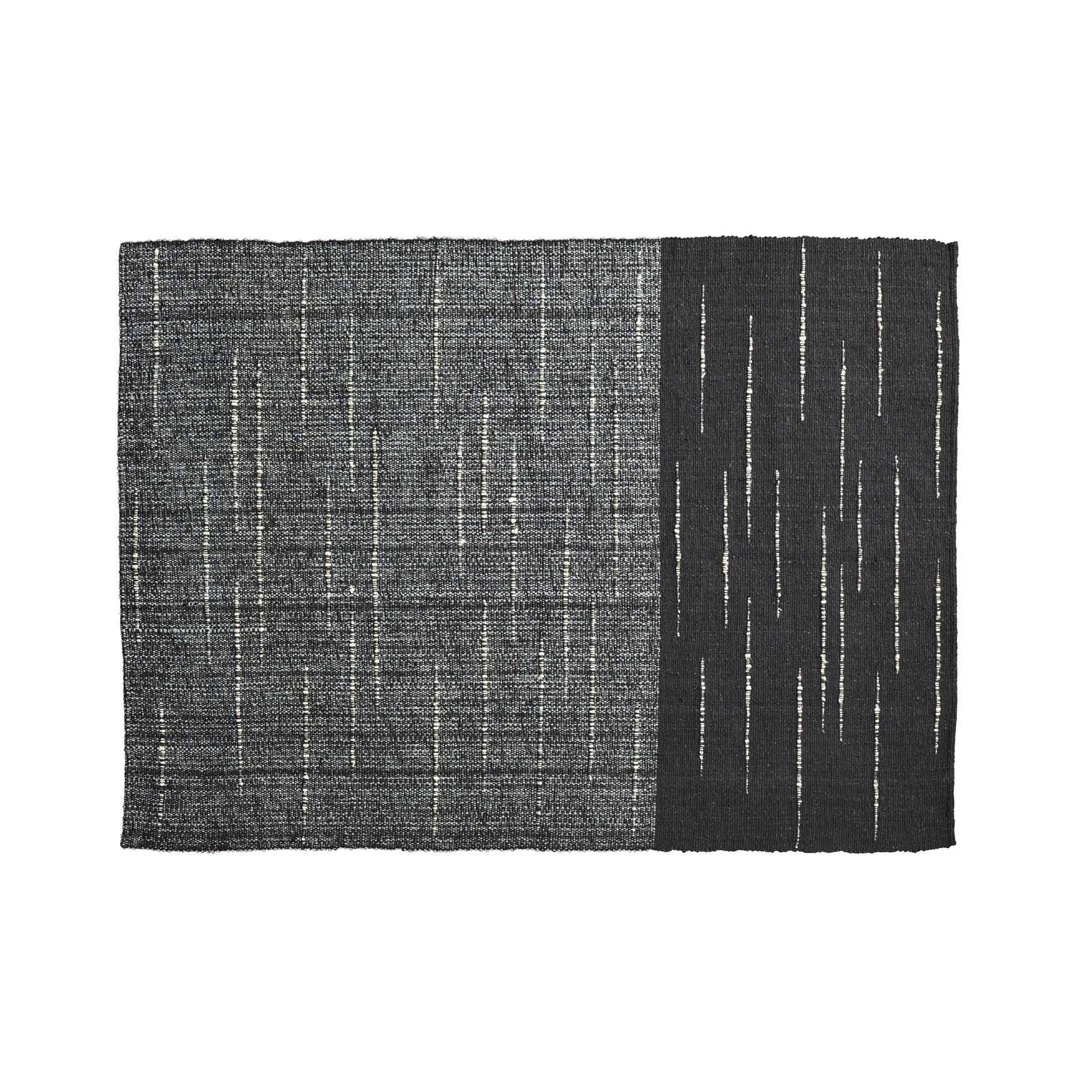 The Ames Subas Rug by Ames is a rectangular wool rug with a dark, speckled gray left side and solid black right side, both accented by thin, irregular vertical white lines in a scattered pattern.