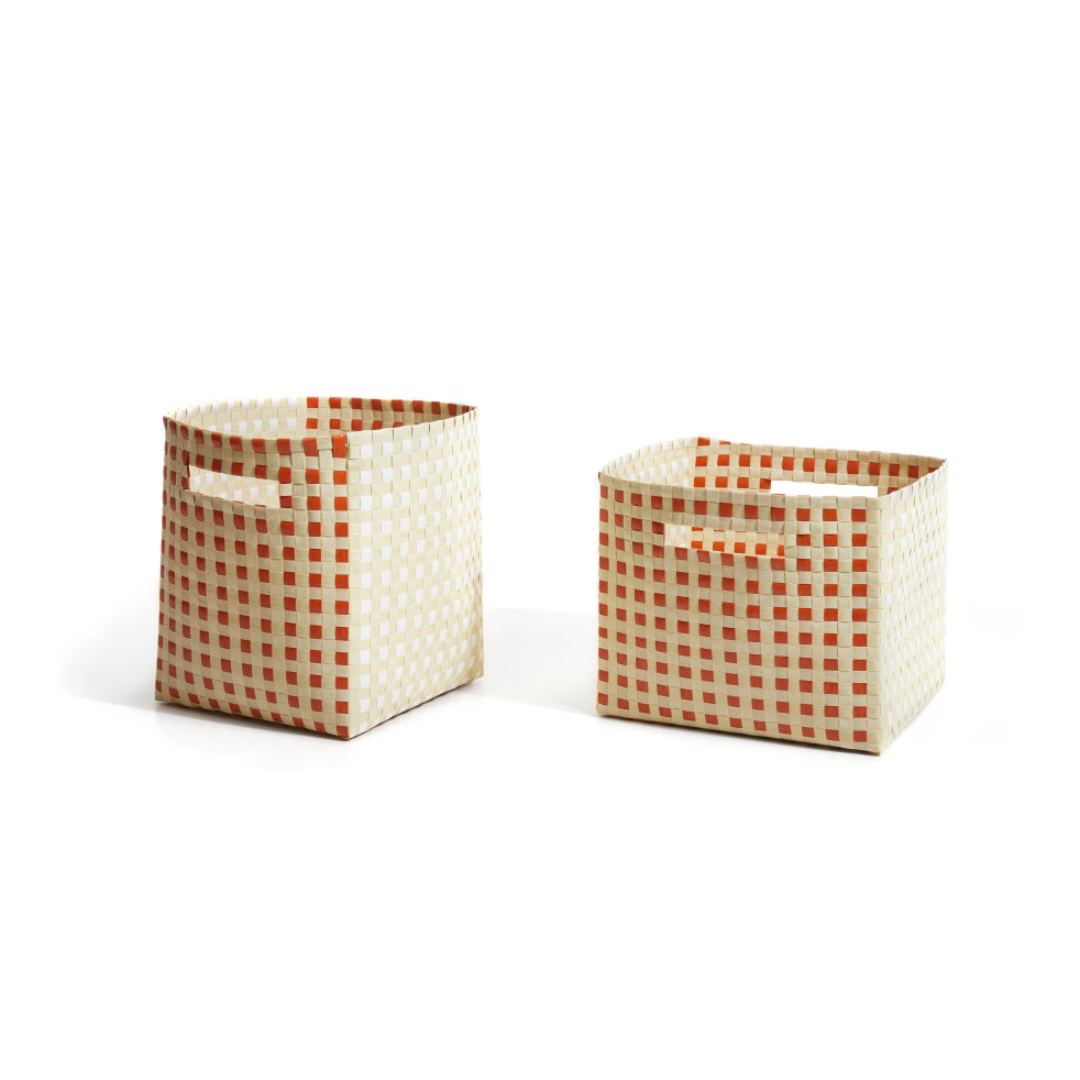 The hand-made Suncho Baskets by Ames feature a red and white checkered pattern crafted from recycled Polypropylene. Designed by Pauline Deltour, they come with convenient handles, combining style and functionality against a crisp white background.