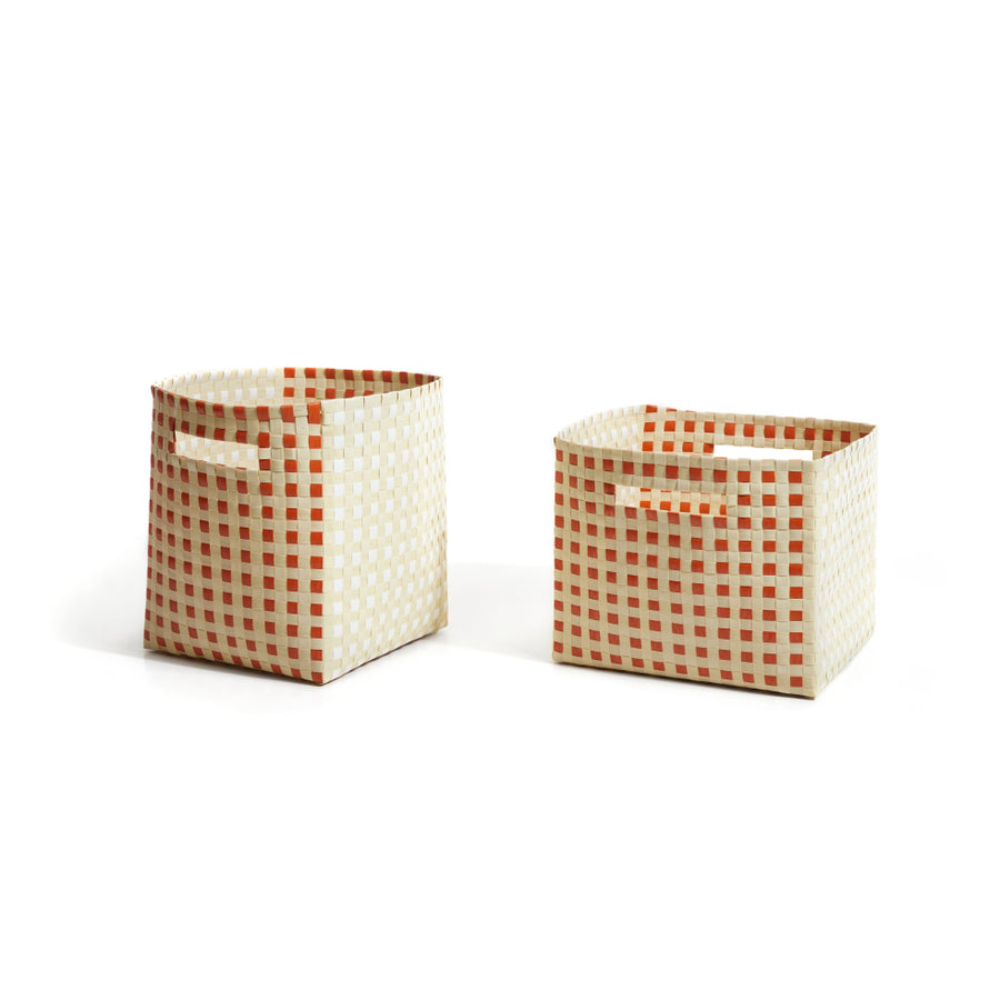 The hand-made Suncho Baskets by Ames feature a red and white checkered pattern crafted from recycled Polypropylene. Designed by Pauline Deltour, they come with convenient handles, combining style and functionality against a crisp white background.