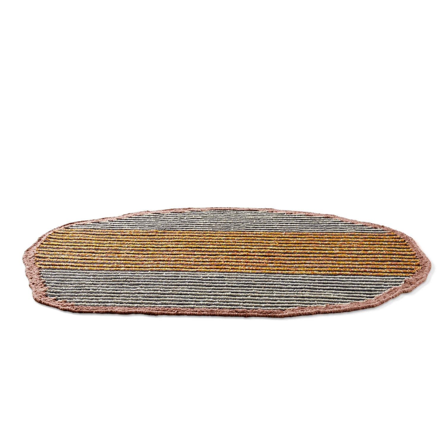 The Uilas Noche Rug by Ames is an oval-shaped piece with a textured surface featuring horizontal stripes in yellow, orange, and gray. A soft pink border with a slightly irregular edge adds luxury, set against a plain white background accented with black-dyed fique fiber.