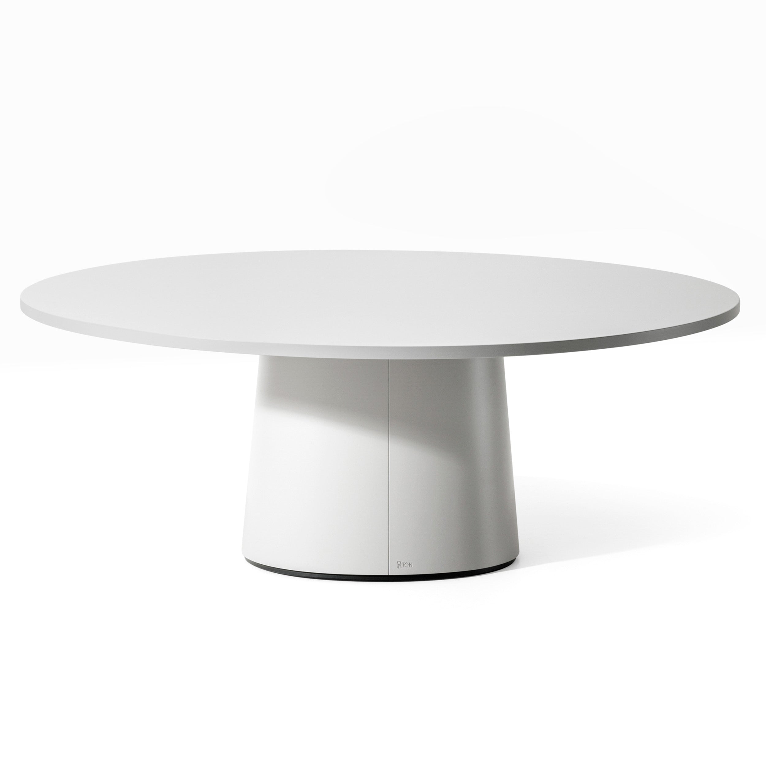 The P.O.V. Coffee Table 474/475 by TON features a modern, minimalist design with a white tabletop and sturdy cylindrical base made from solid wood, available in multiple color finishes to suit any decor.