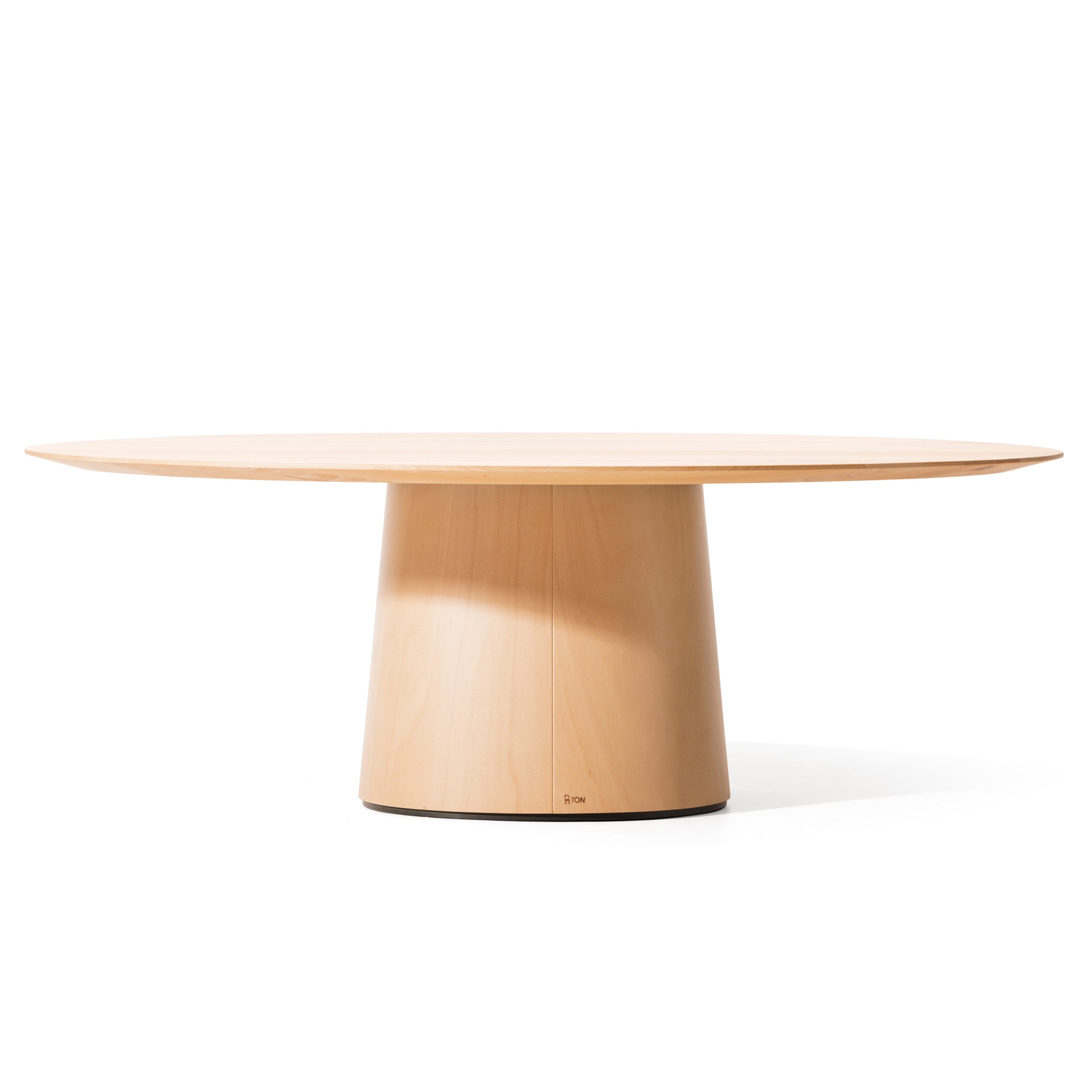 The P.O.V. Coffee Table 474/475 by TON is a minimalist round solid wood table featuring a light-colored smooth surface and a sturdy cylindrical base, shown against a plain white background. It offers versatile color finish options to complement any decor.