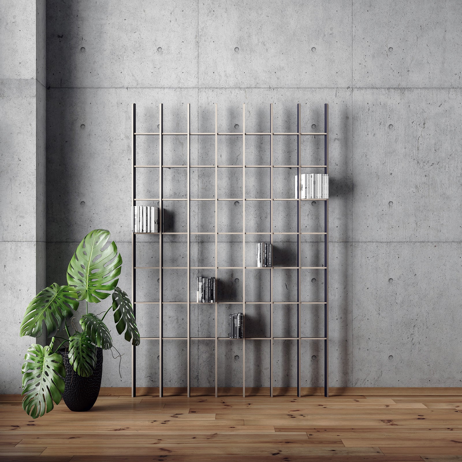 A minimalist interior showcases a concrete wall and the airy Open grid-style bookcase by Martin Breuer Bono, holding a few books. A potted plant with large green leaves on the wooden floor casts a sculptural shadow beside the bookshelf.