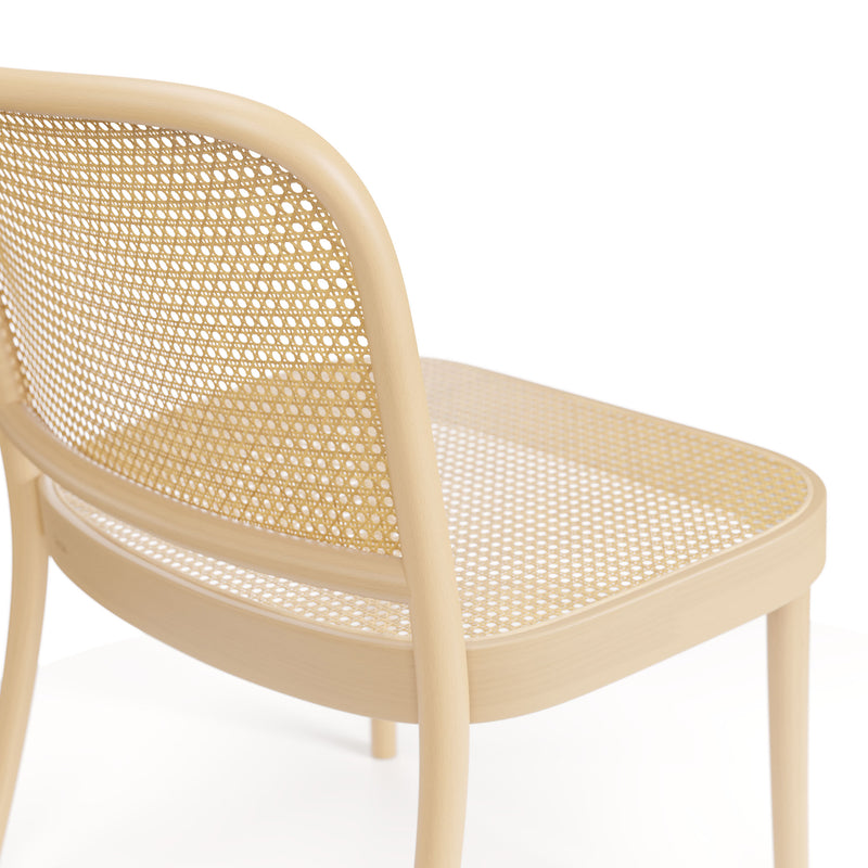 The Loungechair 811 by TON, designed by Claesson Koivisto Rune, is a light wooden armchair with a woven cane backrest and seat. Featuring smooth, rounded edges and a minimalist design, it is shown from the rear on a plain white background—ideal for any relaxation space.