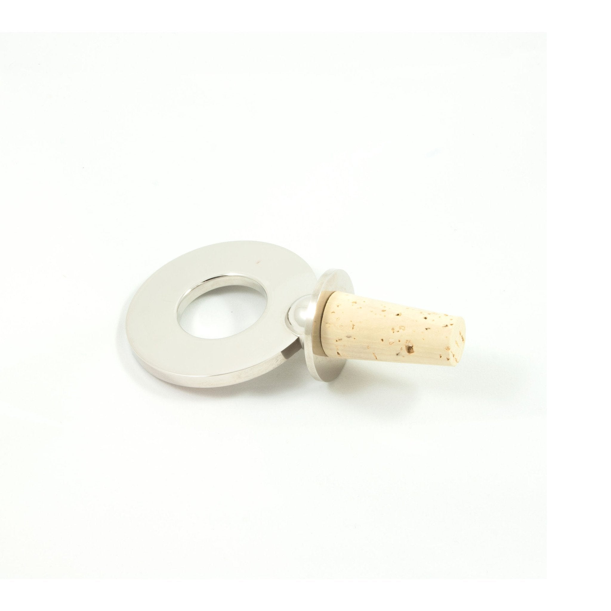 The Werkstätte Carl Auböck Corkstopper Ring #5971 is a round silver bottle opener corkscrew with a large circular handle and light cork stopper, set against a plain white background reminiscent of Triennale di Milano exhibits.