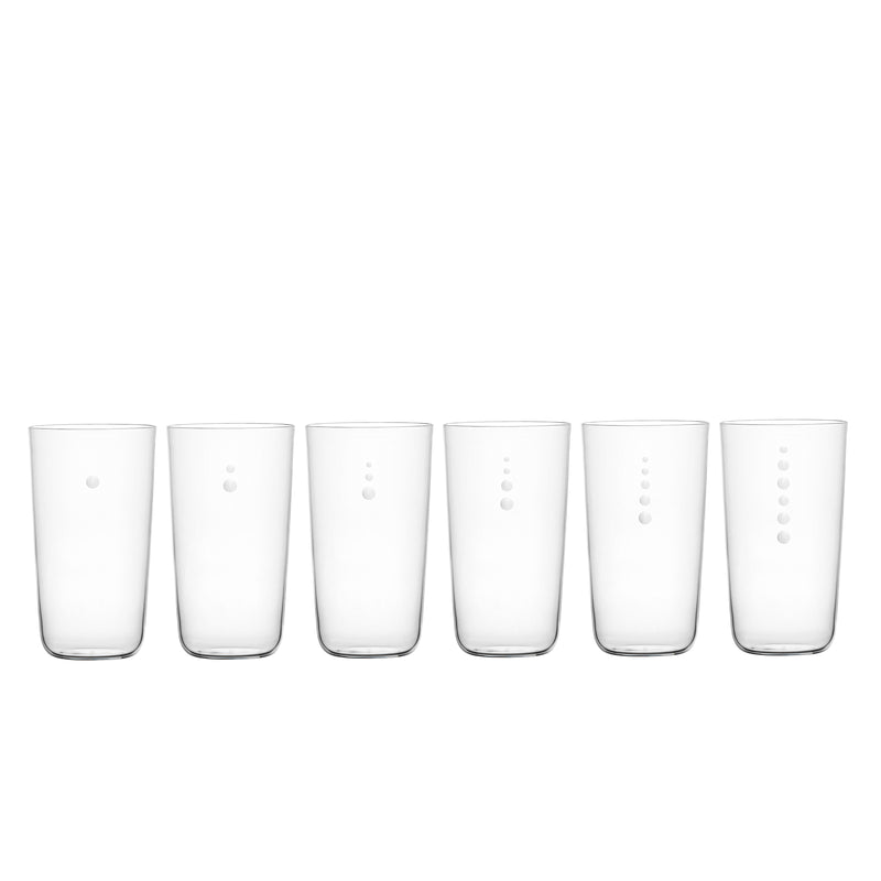 A set of six tall, tumbler-style glasses from Lobmeyrs Drinking Set No. 4 - Now is Better are arranged in a row. Each mouth-blown crystal glass features a unique vertical pattern of small, raised dots against a plain white background.
