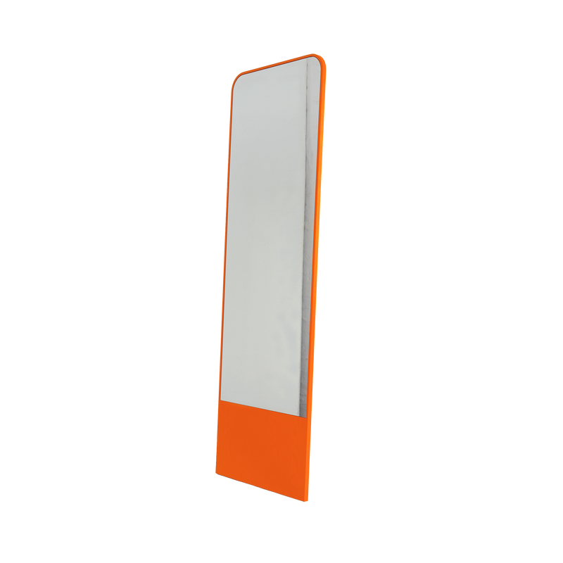 The Friedrich Mirror by Objekte unserer Tage features a tall, narrow, minimalist design with a rectangular shape and vibrant orange frame. Slightly rounded edges and an angled base ensure stability, adding contrast and contemporary style to any living space.