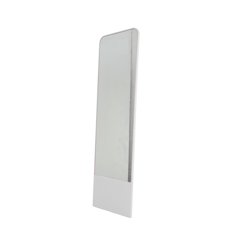The Friedrich Mirror by Objekte unserer Tage is a tall, rectangular full-length mirror with a sleek, minimalist design. It stands on a flat surface with a slight right angle and features a thin frame and white base, ideal for any contemporary living space.