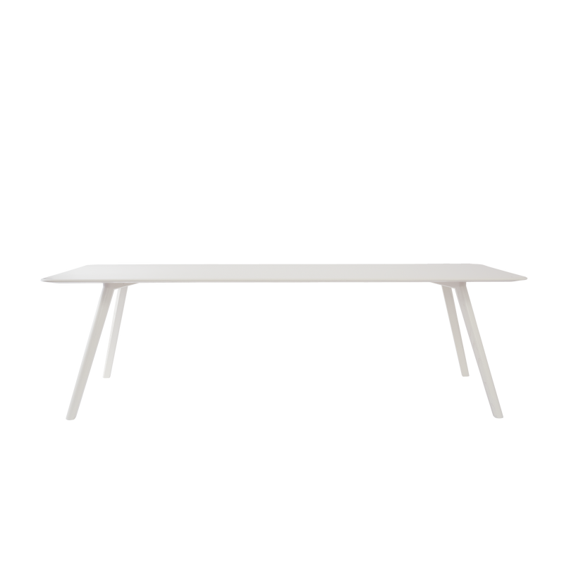 The Meyer Table by Objekte unserer Tage is a minimalist design with a white rectangular top and four angled solid oak legs, set against a bold black background.