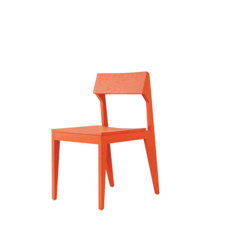 The Schulz Chair by Objekte unserer Tage is a modern, orange wooden chair made from solid ash. It has an angular design with a flat backrest, square seat, and four straight legs, showcased against a white background to highlight its durable elegance.