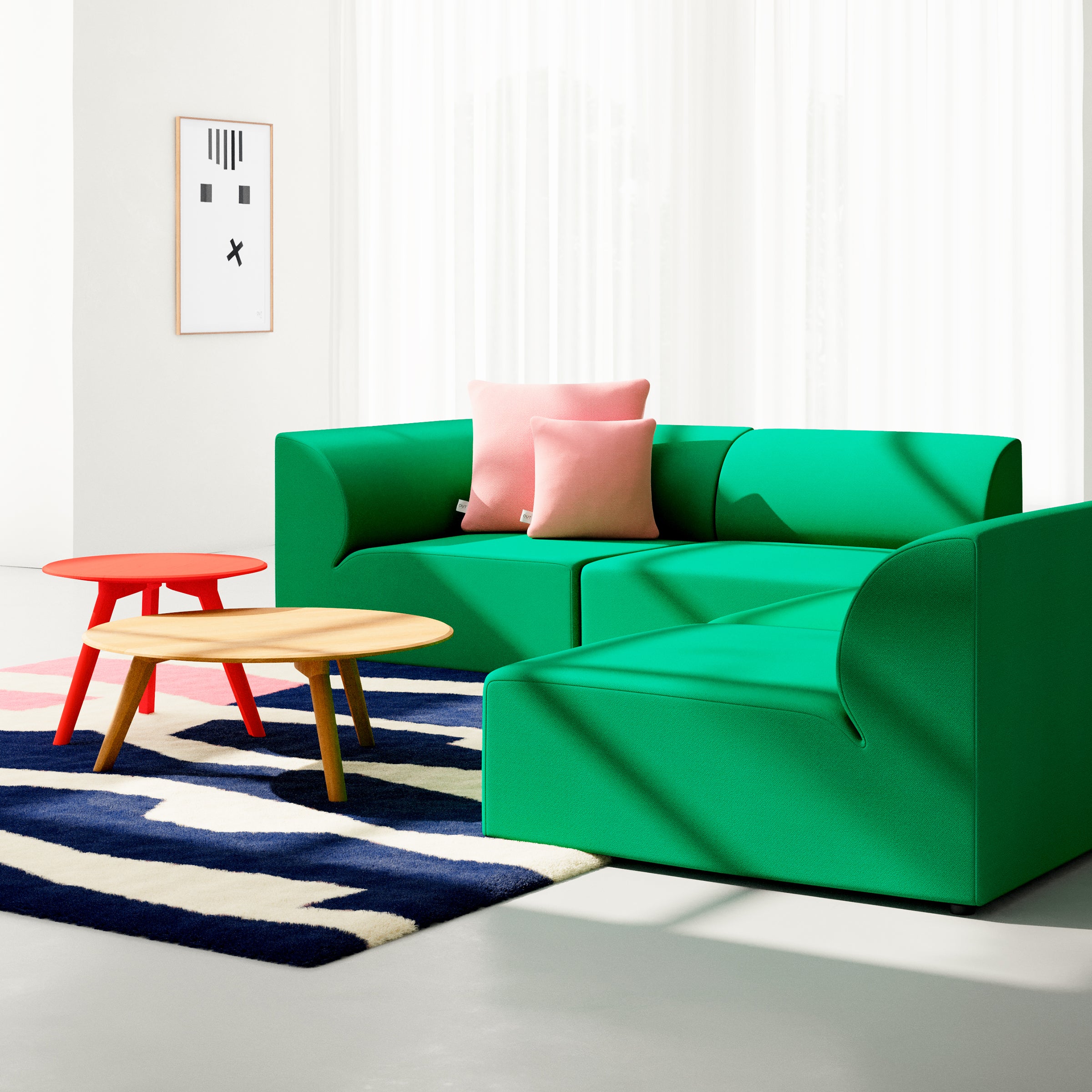 A modern living room features a bright green Objekte unserer Tage Weber modular sofa with two pink cushions. A red side table and light wooden coffee table are set on a navy and white zigzag rug, complemented by minimalist wall art conveying German sensuality against sheer white curtains.
