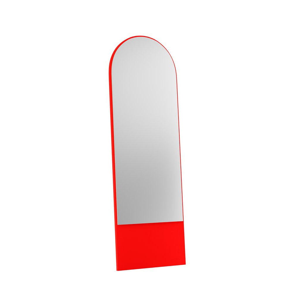 The FRIEDRICH 21 Mirror by Objekte unserer Tage features a tall, round arch and a striking red frame of lacquered ash wood. A solid red panel at the base contrasts against a simple white background for an elegant design.