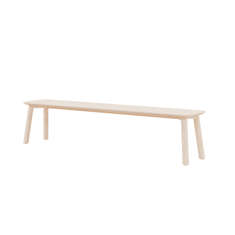 The Meyer 23 Bench by Objekte unserer Tage is a minimalist wooden bench crafted from sustainably sourced solid wood, featuring four slightly angled legs and a smooth, light-colored rectangular seat on a white background.
