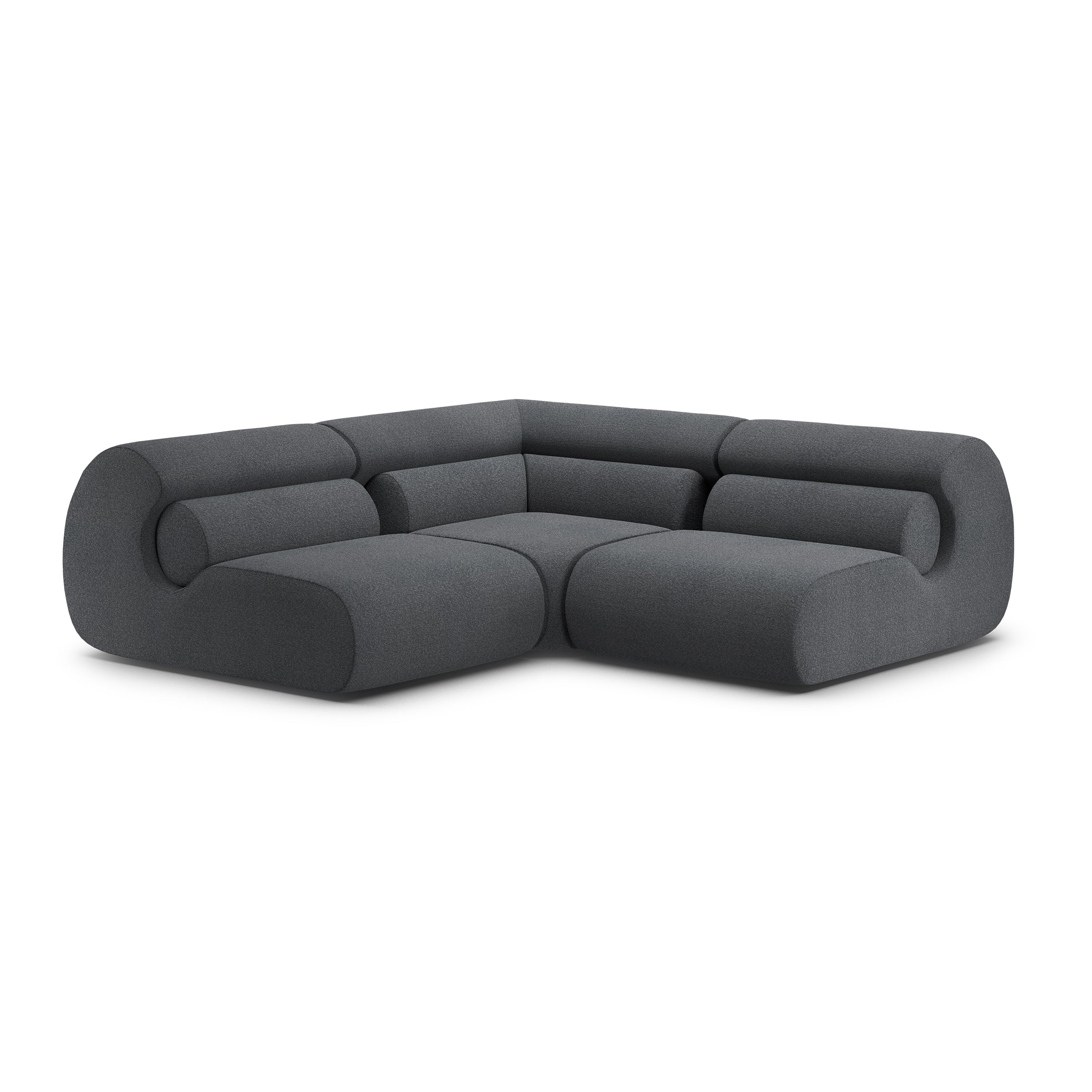 The Ola Sofa by Objekte unserer Tage is a stylish, dark gray L-shaped sectional with smooth, rounded edges and a minimalist design. Its seamless cushions and memory foam offer comfort, making it ideal for modern living spaces while evoking Mediterranean tranquility.