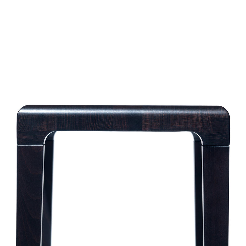 Close-up of the Barstool Rioja by TON, featuring an oak backrest with a sleek, dark brown finish. The minimalist and modern design showcases clean lines against a white background.