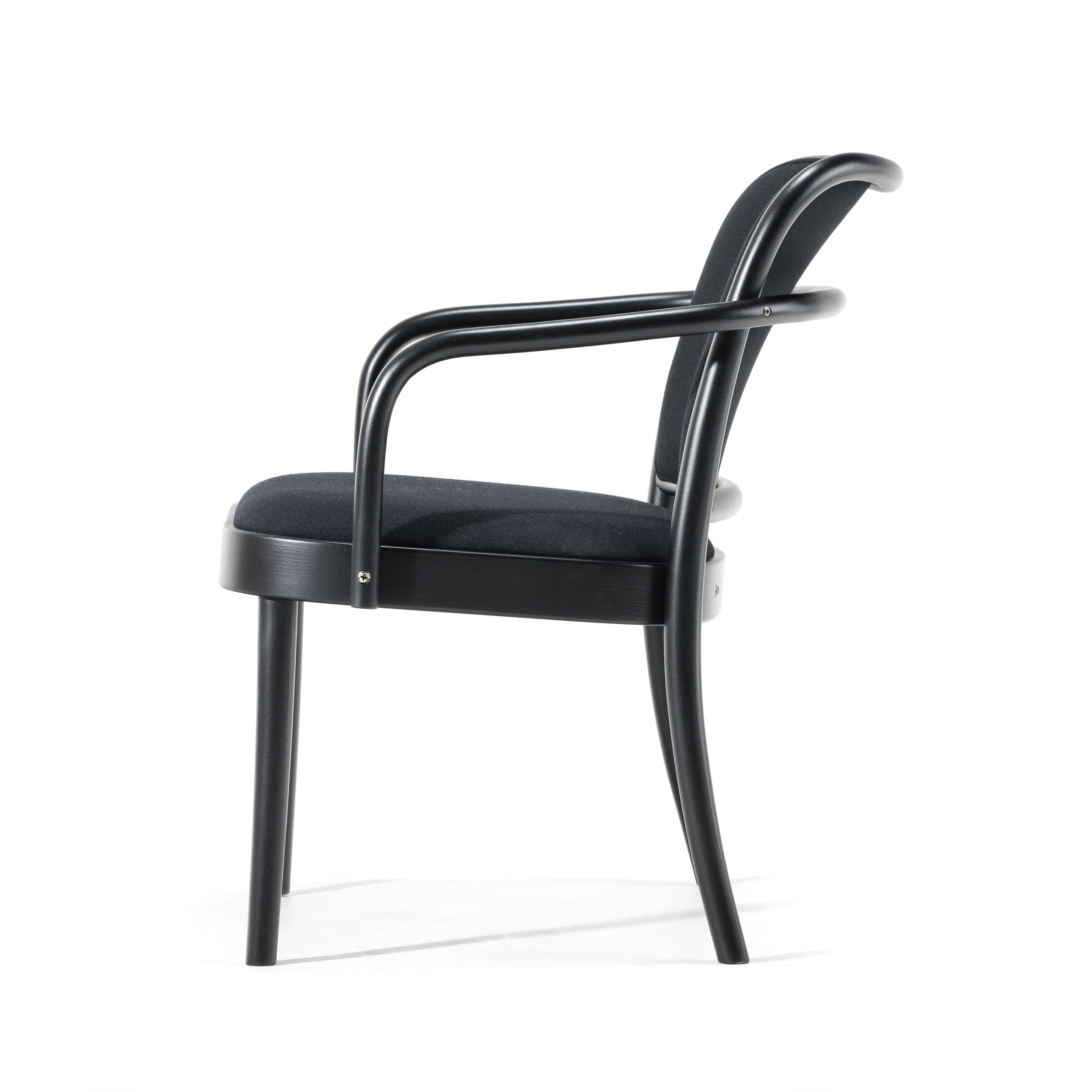The Lounge Armchair 811 by TON is a modern black chair with a curved backrest and armrests. It features a sleek frame, upholstered seat, and stands on four slightly angled legs for a contemporary, elegant look suitable for any setting.